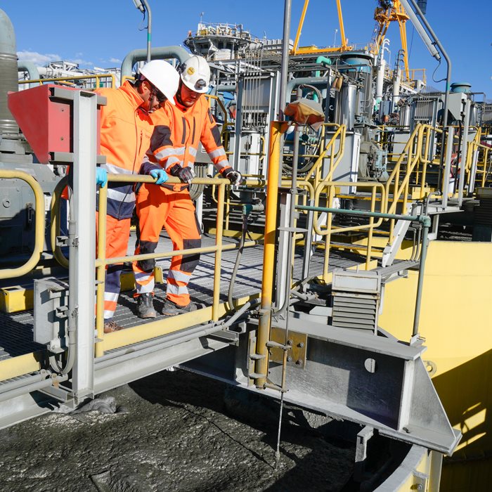 Metso Outotec experts at Constancia mine site overlooking flotation cells