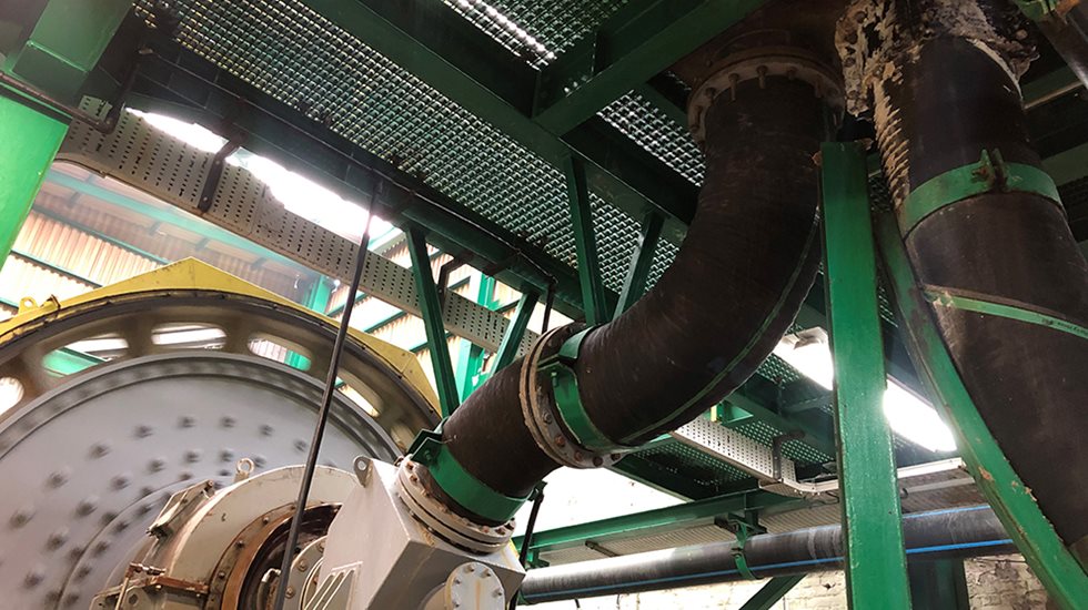 Slurry hose pictured in a mine.
