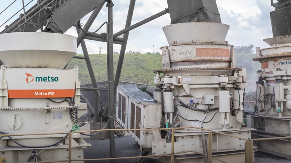 Metso MX crusher next to two older Metso HP crushers.