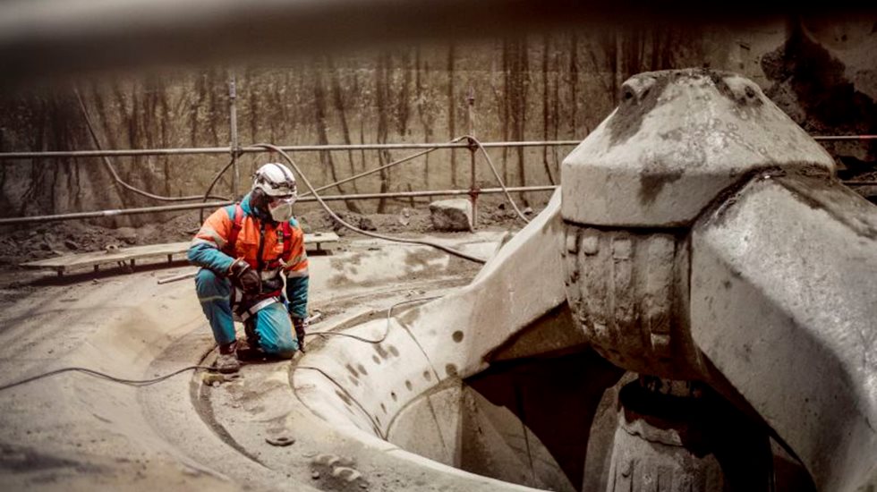 Primary Gyratory crusher with service employee. 