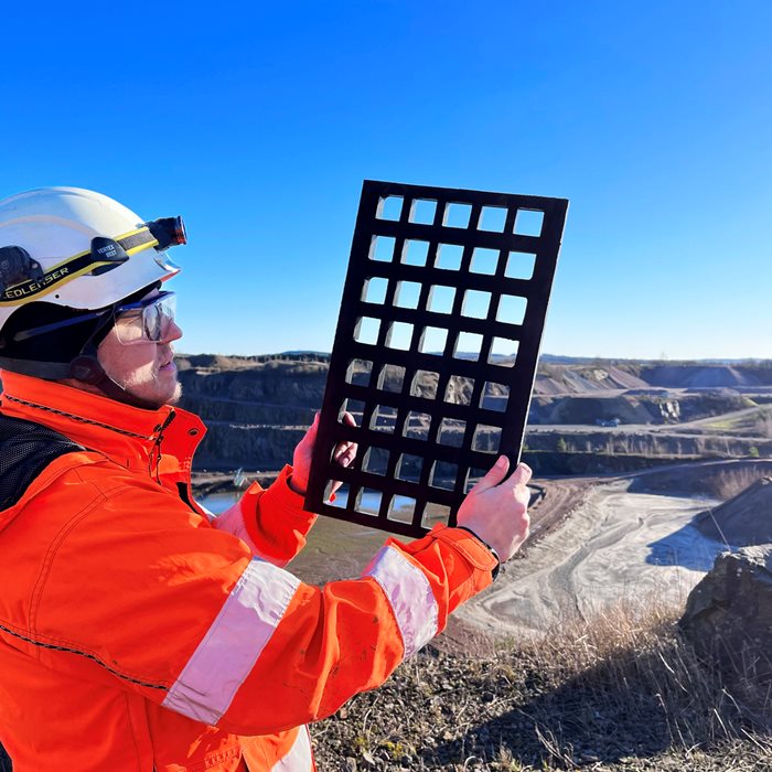 man scrutinizes a modular panel