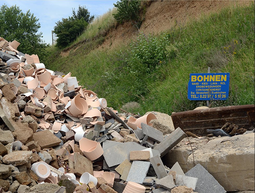 Recycled material next to grass. 