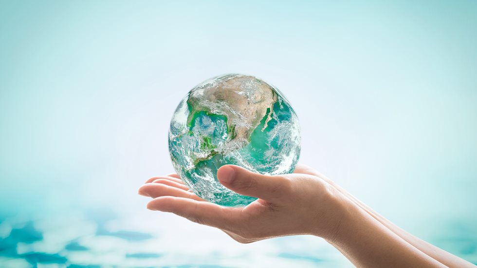 Hand holding the world