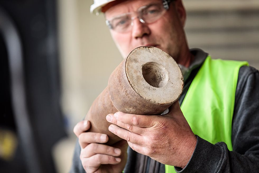 Workman with a fireclay brick