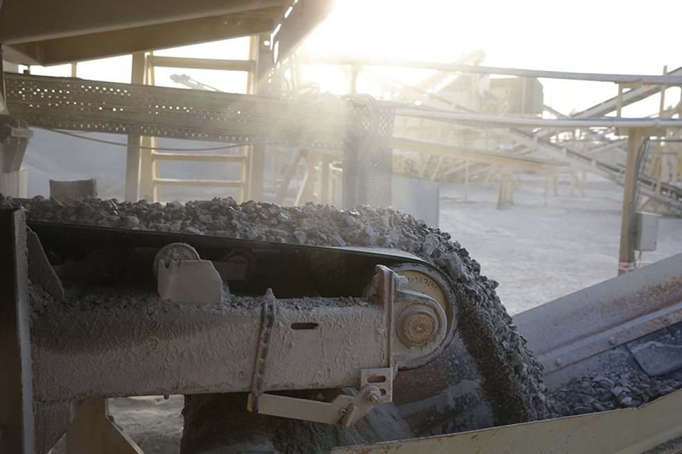 Crushed rock pictured on a conveyor.