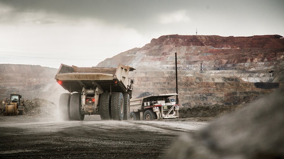 Full haul truck driving away at Grupo Mexico site.