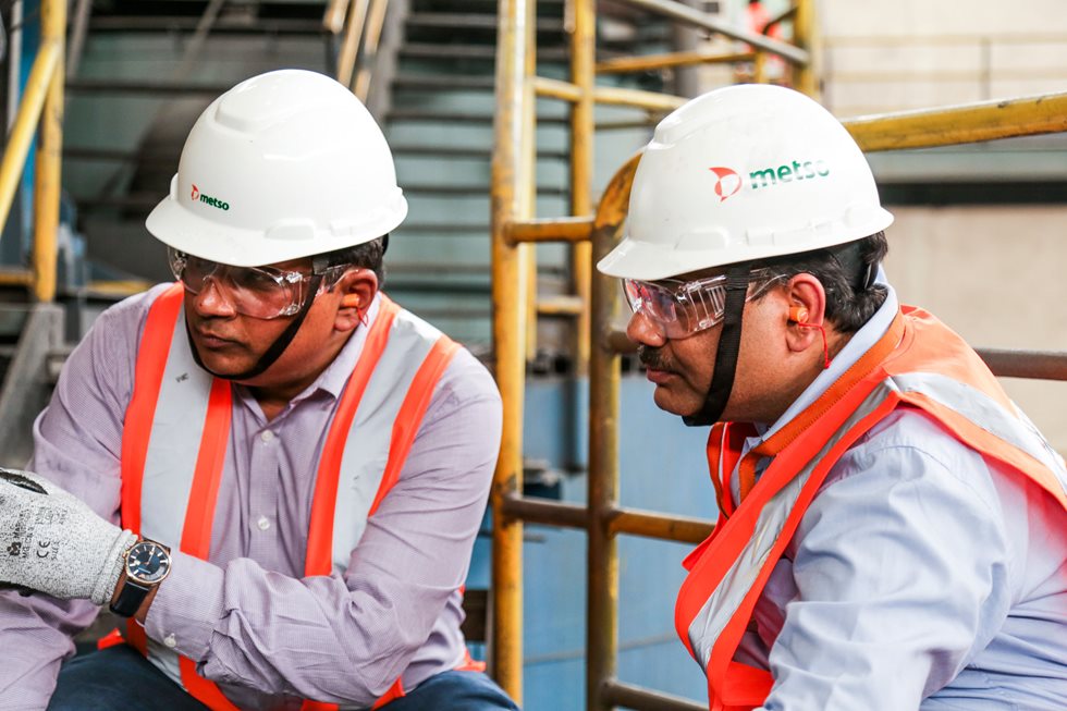 Two men in Metso helmets. 