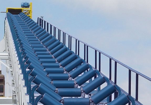 Conveyor idlers and rollers