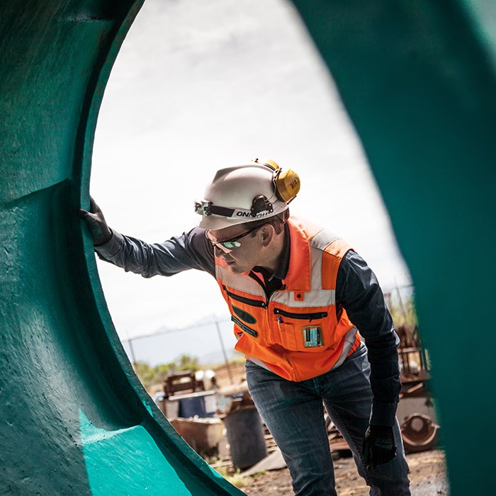 Metso expert next to cone crusher wear part
