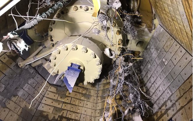 Too much trash put into crusher causing build up and consequent higher wear